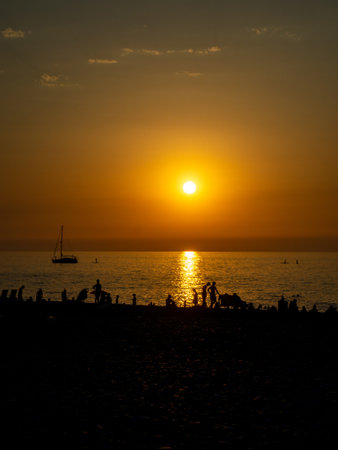 Sunset on the black sea. Play of colors at sunset. Twilight on the water. A nice place. Landscape on the south coast. Ship silhouettesの写真素材
