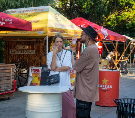 Batumi, Georgia. 08.19.2023  Beer Festival. Tents with draft beer. Foam tasting. People relax and drink. Holiday soft drink. Holiday on the streetのeditorial素材