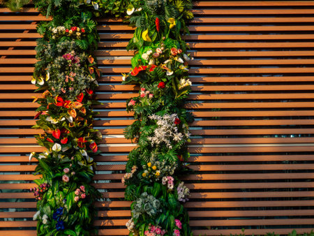Decoration of the facade of the building with artificial flowers. Building in flowers. Resort place. Facades of buildings. Interesting design idea. Modern designの写真素材