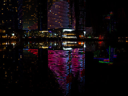 Night city in lights. High-rise buildings at the resort. Restaurants and hotels at night. New Batumiの写真素材