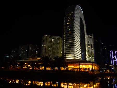 Night city in lights. High-rise buildings at the resort. Just like in Las Vegas. Restaurants and hotels at night. New Batumiの写真素材