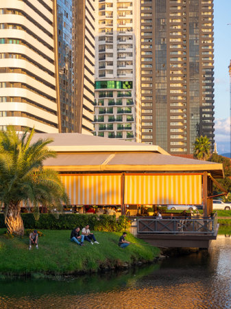 Batumi, Georgia. 09.10.2023 City lake. Fishing in the park. City infrastructure. Ralax. A beautiful place in the city at sunset.のeditorial素材