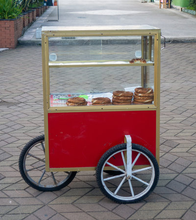 Mobile stall with Turkish pretzels. Snack on the go. Small business at the resort. Sale of bakery...