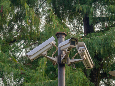 Street surveillance camera on a pole.   Against crime. Recording on a stationary camera. Fighting crime. Concept of issuing a fine. Traffic monitoring. Maintaining orderの写真素材