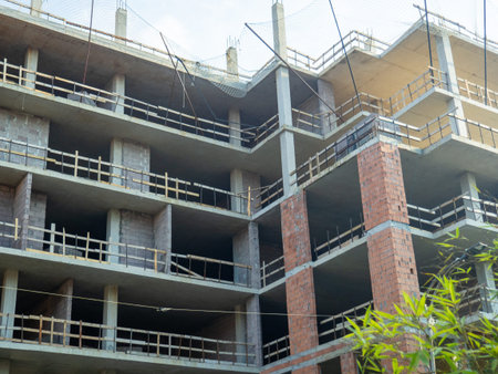 Construction is in full swing. House made of red blocks and reinforced concrete. Wooden sides for...