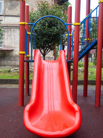 Plastic playground. Safe game for children. City infrastructure.   slides made of plastic. Entertainment. Playground in the yard.の写真素材