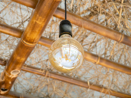 Lighting in a cafe. Interior detail. The lamp does not light up. Lighting device during daylight hours.  Electricityの写真素材
