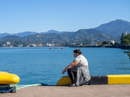 Batumi, Georgia. 10.14.2023 Fishermen in the port of Batumi. Waiting for a peck. People on vacation. Hobbies for people. Day off at the port. Fish catchersのeditorial素材