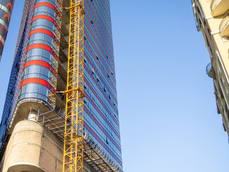 Modern construction of a high-rise building. Modern architecture of a business center. Apartment in a high-rise building. Glazed high-rise buildingの写真素材
