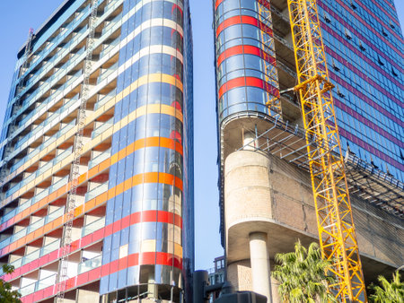 Modern construction of a high-rise building. Modern architecture of a business center. Apartment in a high-rise building. Glazed high-rise buildingの写真素材