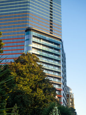 Modern construction of a high-rise building. Modern architecture of a business center. Apartment in a high-rise building. Glazed high-rise buildingの写真素材