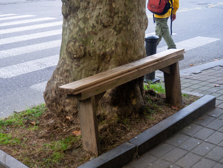 A rickety bench on the street. Seat for people. Poor infrastructure. Bench in the cityの写真素材