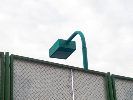 Brutal lamp over the sports ground. Modern lighting. Lantern in the park. Rectangular shape....