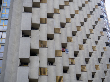 Balconies of unusual shape. Architecture background. Constructivism. Uneven house. High-rise...