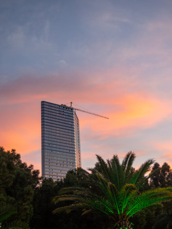 Construction of a multi-storey building against the backdrop of the sunset sky. Construction at the...