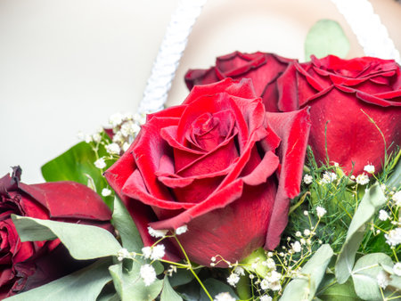 Red roses close-up. Congratulations concept. Birthday gift. Basket of flowers. Petalsの写真素材