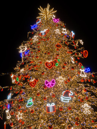 New Year tree on the city square. Lights on the street at night. City square on New Year's Day. Garlands for decorationの写真素材