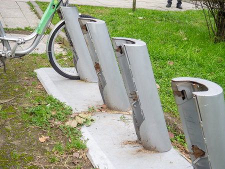 Empty parking lot for rented bicycles. A post for attaching a bicycle. Two-wheeler rental concept. Urban environmentの写真素材