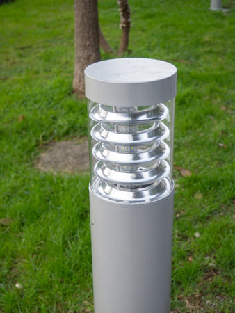 Modern lantern in the park. Lawn light. Low lamp on the street. Lighting pole. Technologiesの写真素材