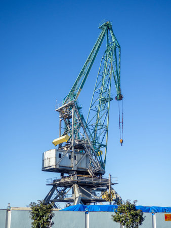 Marine cranes. Loading heavy loads. Cranes against the sky. Port concept