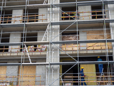 Modern construction. View from bottom to top. concrete frame. Industry. Scaffolding.