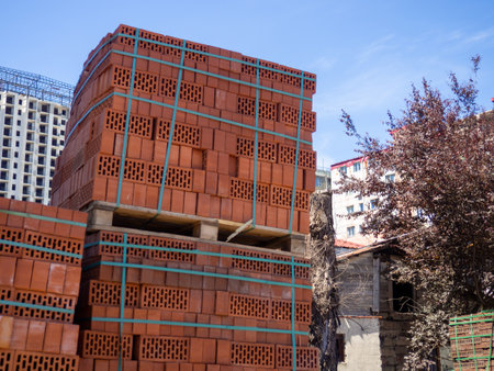 Sale of construction materials on the street. Open air market for building materials. A bunch of bricks in sleepers. Construction preparation conceptの写真素材