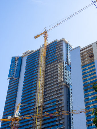 Construction of a multi-storey building. Housing industry. A place for people to settle. Modern architectureの写真素材