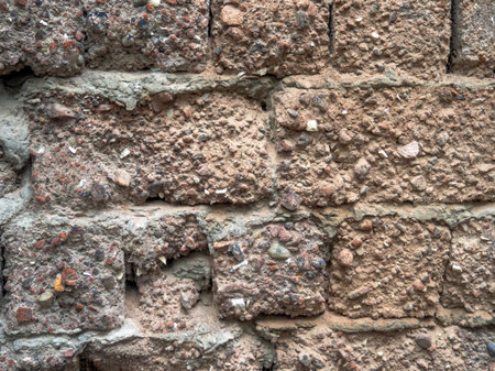 Stone background. Old stonework. Walls made of cement and stones. Hard material