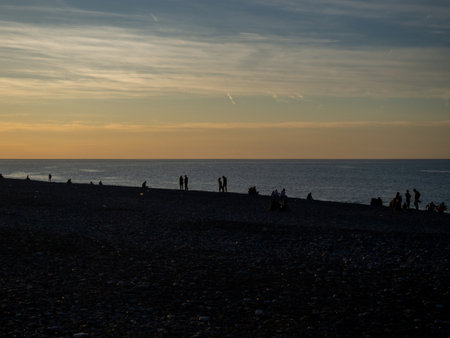 Batumi, Georgia. 10.23.2024  People on the seashore. People watching the sunset. Resort place. Silhouettes of people. Black Sea coastの写真素材