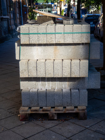 Block with paving stones on the street. Preparation for pavement repair. Stones on the sidewalk.の写真素材