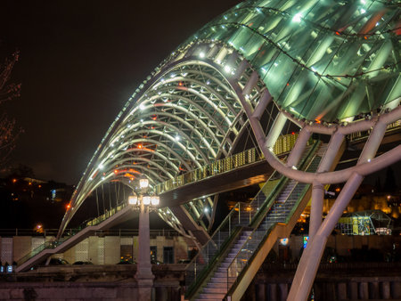 Peace Bridge in Tbilisi at night. Night cityscape. Bridge of modern architecture. Glass structureの写真素材