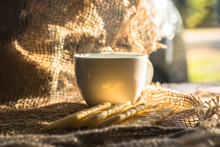 Hot morning in the morning with delicious bread on the table with a beautiful rope.の写真素材
