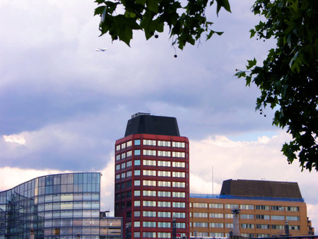  London offices with an aircraft flying over         