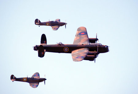 Bomber and fighter patrol the skies in formation        