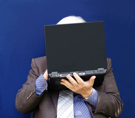 Mature male using his laptop will take text        
