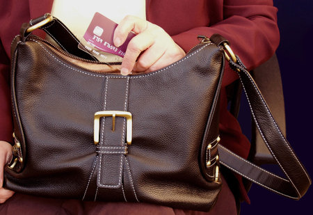 Handbag with the most powerful hand in the world       の写真素材