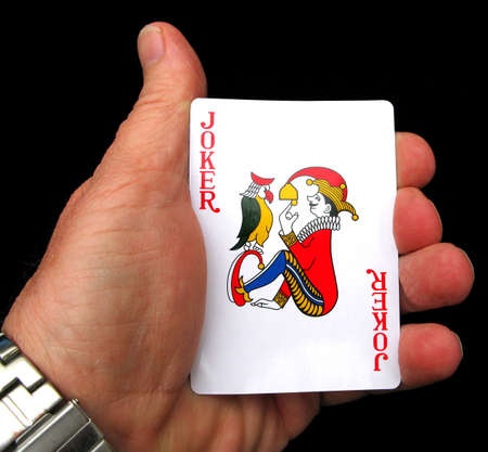 Holding the joker in the pack a manのeditorial素材