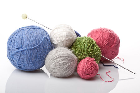 colorful yarn balls on white background