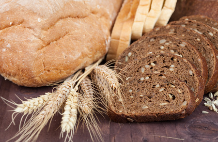 fresh bread and wheat on the woodenの写真素材
