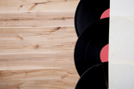 top view of vinyl records over wooden tableの写真素材
