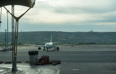 Airplane parked in Madrid Barajas, Adolfo Suarez airportの写真素材