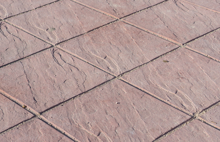 Stamped concrete floor outdoor pavement red square pattern detailの写真素材
