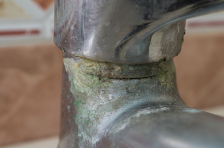 Water tap in detail with limescale close up soiled bathroom Calcified faucetの写真素材