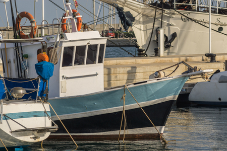 small blue boat, behind the brigantine Cervantes Saavedra, sailboat with two mastsの写真素材