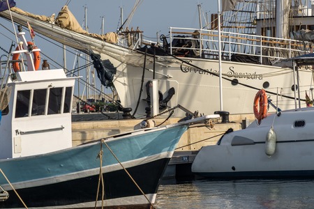 brigantine Cervantes Saavedra, sailboat with two masts, small blue boat in frontの写真素材