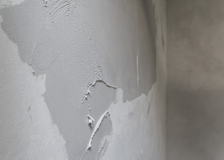the final thin and fine microcement layer before to be smooth with the trowel wallcovering microtopping coating over thick preparation layersの写真素材