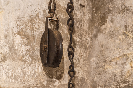 Old pulley with chain in detail vintageの写真素材