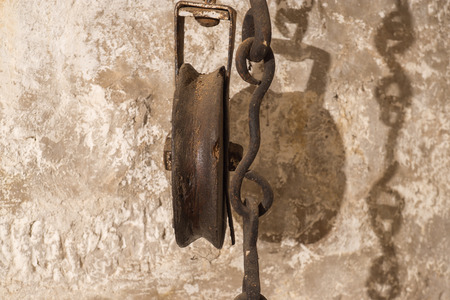 Old pulley with chain in detail vintageの写真素材