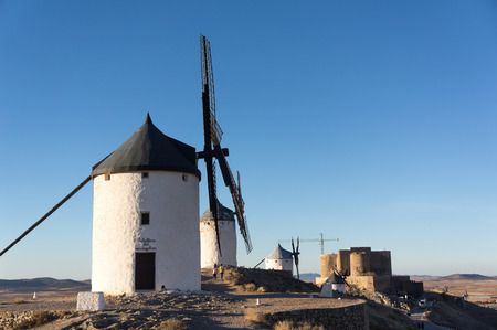 Windmill group in cerro Calderico, Consuegra, Toledo, Castilla-La Mancha, Spain, warm color of the sunset sunの写真素材