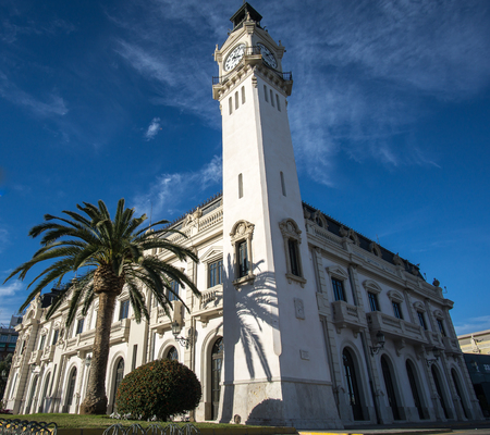 Port Authority buildings with clock tower in Valencia harbor, Spain, ultra wide angleの写真素材